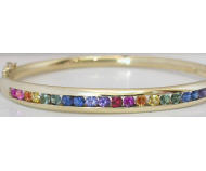 Channel Set Natural Rainbow Sapphire Bangle Bracelet in solid 14k yellow gold. LGTB pride.