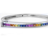 Natural Rainbow Sapphire Bangle Bracelet in solid1 4k white gold with channel set real princess cut sapphires.