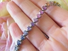 Rainbow sapphire tennis bracelet in solid 14k white gold with natural heart cut sapphires for sale