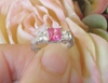 Natural Princess Cut Pink Sapphire Three Stone Engagement Ring with White Sapphires in white gold for sale