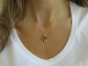 Woman's Natural Sapphire Solitaire Cross Pendant in 14k yellow gold
