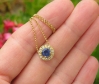 Round Natural Blue Sapphire Solitaire Pendant with a Diamond Halo in 14k yellow gold