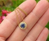 Round Natural Blue Sapphire Solitaire Pendant with a Diamond Halo in 14k yellow gold