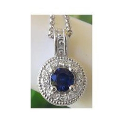 Royal Blue Natural Sapphire Pendant with a Diamond Halo in solid 14k white gold for sale