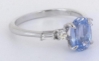 Cornflower blue sapphire ring with baguette and round diamond accents
