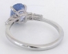 Cornflower blue sapphire ring with baguette and round diamond accents back view
