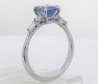 Natural blue sapphire engagement ring with diamond side stones