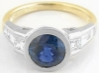 Natural Blue Sapphire Bezel Set Engagement ring with real princess and baguette diamonds in solid 18k white gold for sale