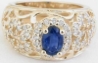 Natural Oval Sapphire Ring with Open Flower Design in solid 14k yellow gold for sale