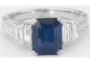 Natural Rich Blue Sapphire in an Emerald Cut Flanked by Pairs of Fine Baguette Diamonds in Vintage Inspired Setting