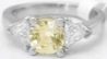 Natural Cushion Cut Yellow Sapphire Three Stone Ring with Trillion White Sapphires in 14k white gold