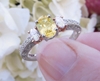 Oval Natural Yellow Sapphire Engagement Ring with real oval side diamonds in a vintage style setting in solid platinum for sale