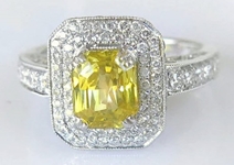 Natural Yellow Sapphire Ring- Radiant Emerald Cut with a Double Diamond Halo in 14k white gold for sale