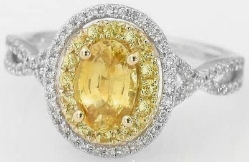 Halo set natural yellow sapphire engagement ring in 14k white and yellow gold