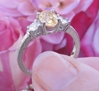 Natural Oval Light Yellow Sapphire and Round White Sapphire Engagement Ring in 14k white gold for sale