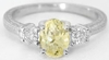 Natural Oval Light Yellow Sapphire Ring with Round White Sapphires in 14k white gold for sale