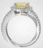 Side view displays the low profile of the unheated round yellow sapphire diamond halo ring in 14k white gold