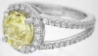 Split Shank with shared prong diamonds featuring 9mm Round Yellow Sapphire with Diamond Halo in 14k white gold