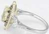 Untreated Oval Yellow Sapphire and Diamond Halo Ring in 14k white and yellow gold